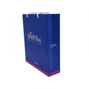White Card Paper Bag - custom packaging for corporate gifting in Singapore with custom logo branding. It is commonly used for retail packaging and branding.