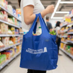 Foldable Grocery Bag with Pouch - branded bags and pouches for corporate gifting in Singapore with custom logo branding. A foldable grocery bag with a pouch is a lightweight, reusable bag that folds neatly into a small pouch for easy storage.