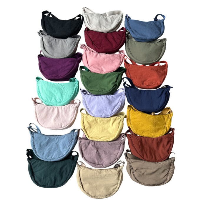 Bag - branded bags and pouches for corporate gifting in Singapore with custom logo branding. Half moon sling bag features a sleek, curved design that offers a stylish, compact look.