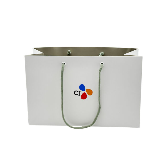 White Card Paper Bag - custom packaging for corporate gifting in Singapore with custom logo branding. It is commonly used for retail packaging and branding.