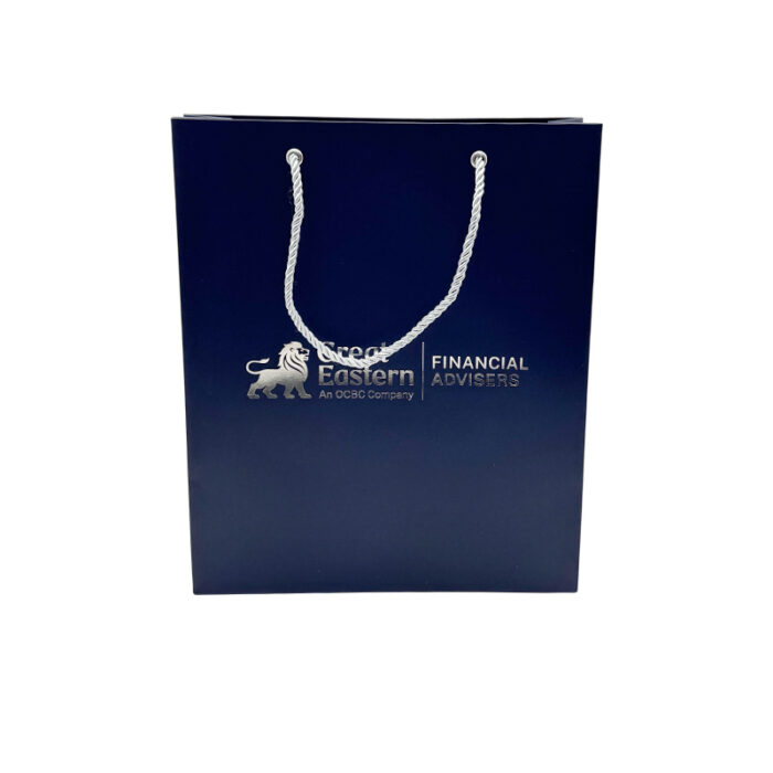 White Card Paper Bag - custom packaging for corporate gifting in Singapore with custom logo branding. It is commonly used for retail packaging and branding.