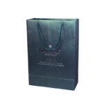 White Card Paper Bag - custom packaging for corporate gifting in Singapore with custom logo branding. It is commonly used for retail packaging and branding.