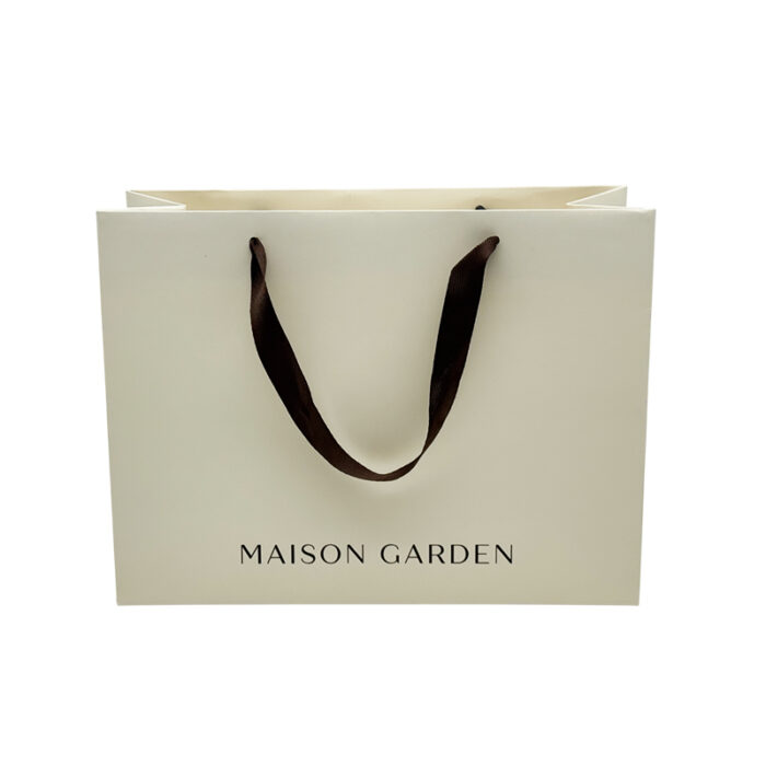 White Card Paper Bag - custom packaging for corporate gifting in Singapore with custom logo branding. It is commonly used for retail packaging and branding.