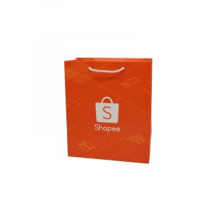 White Card Paper Bag - custom packaging for corporate gifting in Singapore with custom logo branding. It is commonly used for retail packaging and branding.
