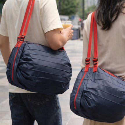 Large Compact Foldable Shopping Bag - branded bags and pouches for corporate gifting in Singapore with custom logo branding. The Large Compact Foldable Shopping Bag is a spacious, eco-friendly bag that folds neatly for easy storage.