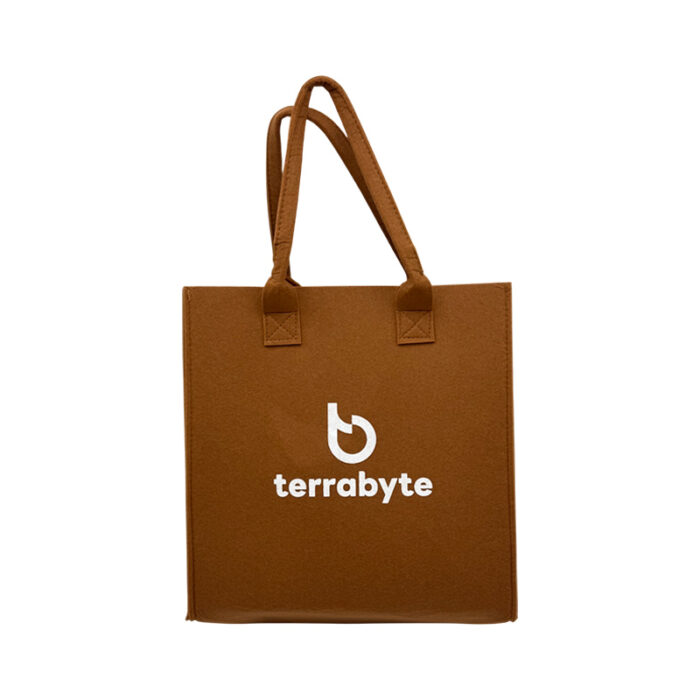 Felt Bag- branded bags and pouches for corporate gifting in Singapore with custom logo branding. The felt bag features a minimalist design crafted from soft yet sturdy felt material, offering both style and durability.
