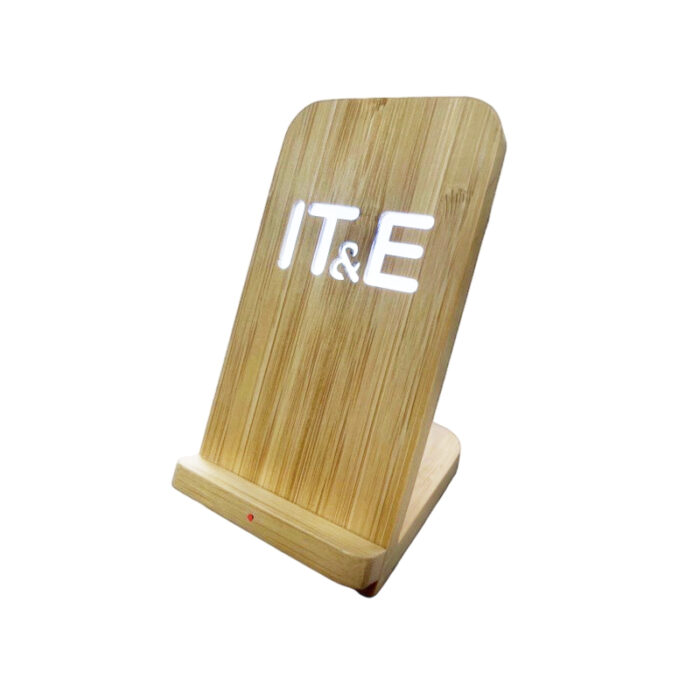 Bamboo Wireless Charging Stand - custom corporate gift for corporate gifting in Singapore with custom logo branding. Eco-friendly bamboo 2-in-1 stand for wireless charging and holding your phone. Sleek, space-saving design keeps your desk organized while charging.