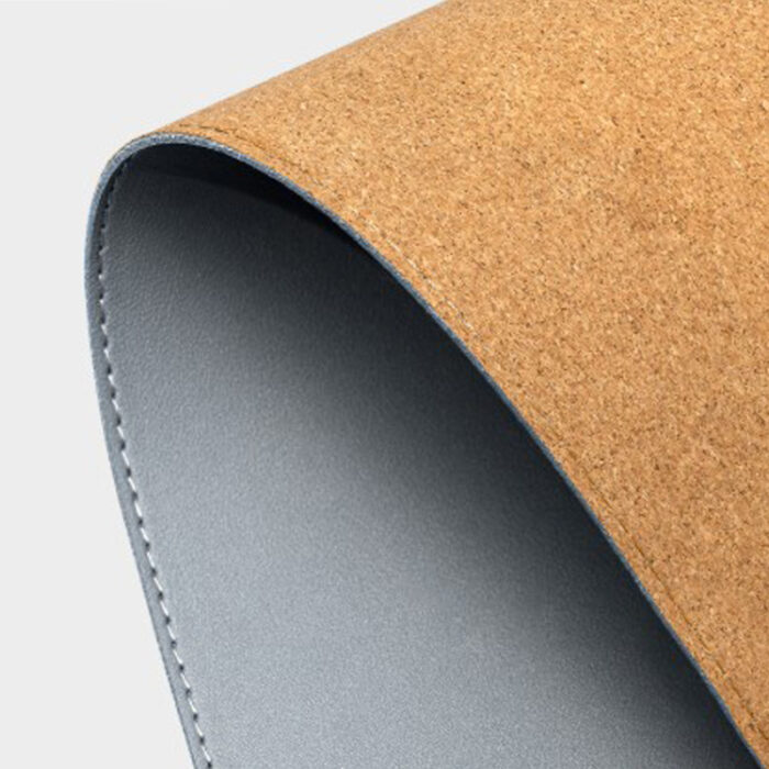 Cork and Leather Desk Mat - Gadgets & Electronics gifts for corporate gifting in Singapore with custom logo branding.This desk mat crafted from PU leather and eco-friendly cork. It enhances your workspace with a smooth surface and modern, minimalist design.
