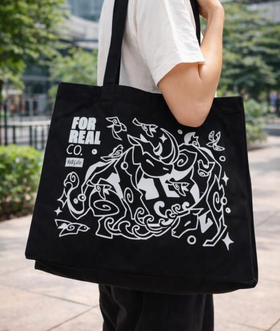 a guy carrying a customised black totebag