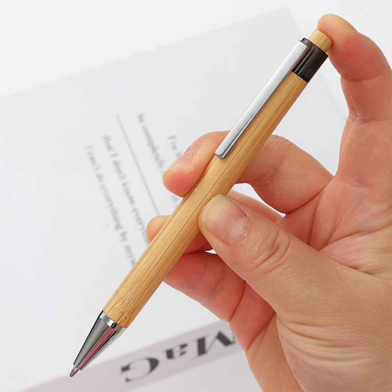 Bamboo Click Pen - Stationery corporate gifts for corporate gifting in Singapore with custom logo branding. Bamboo Click Pen is an eco-friendly writing essential crafted from sustainably sourced bamboo, blending modern functionality with natural elegance.